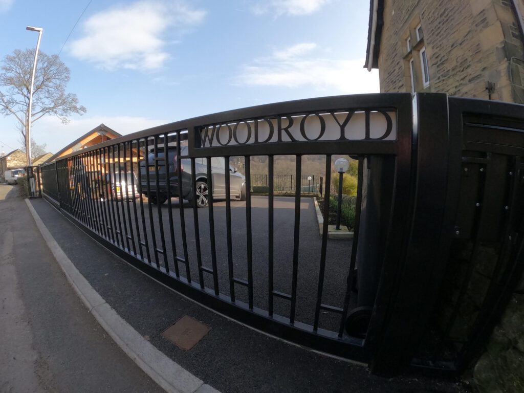 Wrought Iron Telescopic Gate with Videx GSM Intercom. Also includes LED Warning Light.